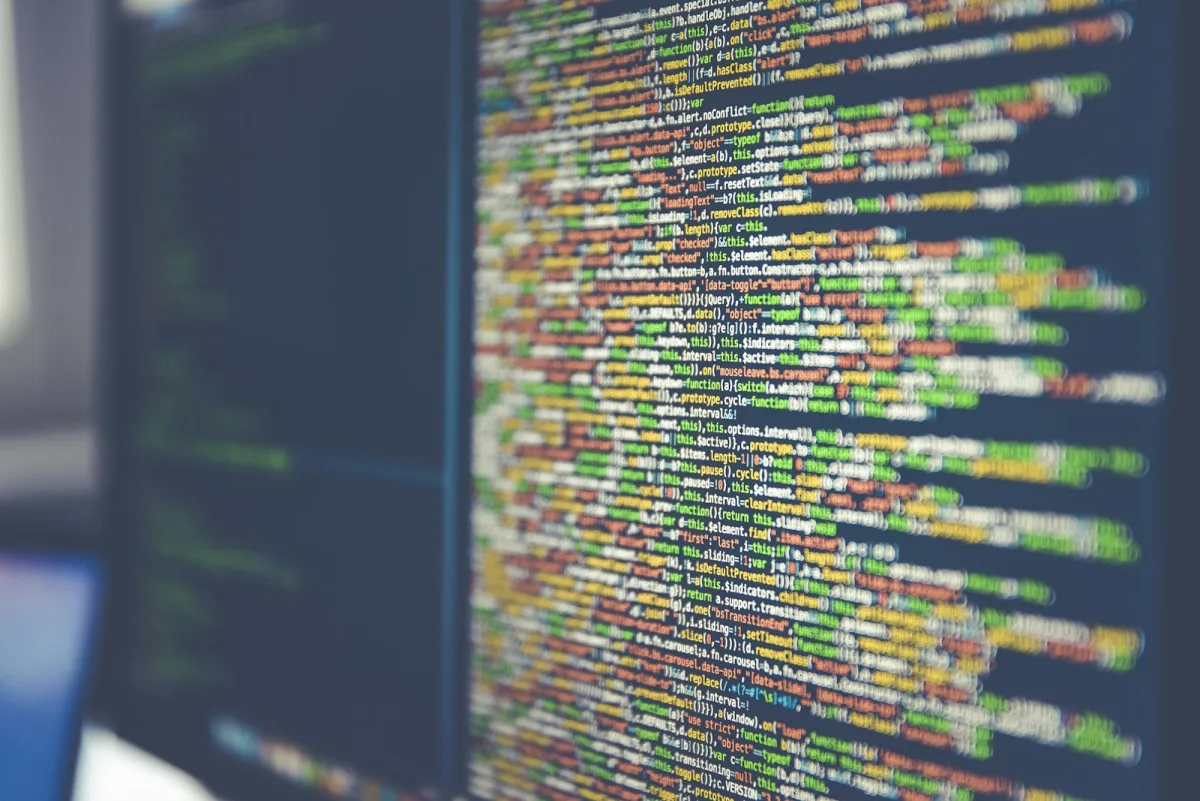 Dense legacy source code filling a monitor at an angle